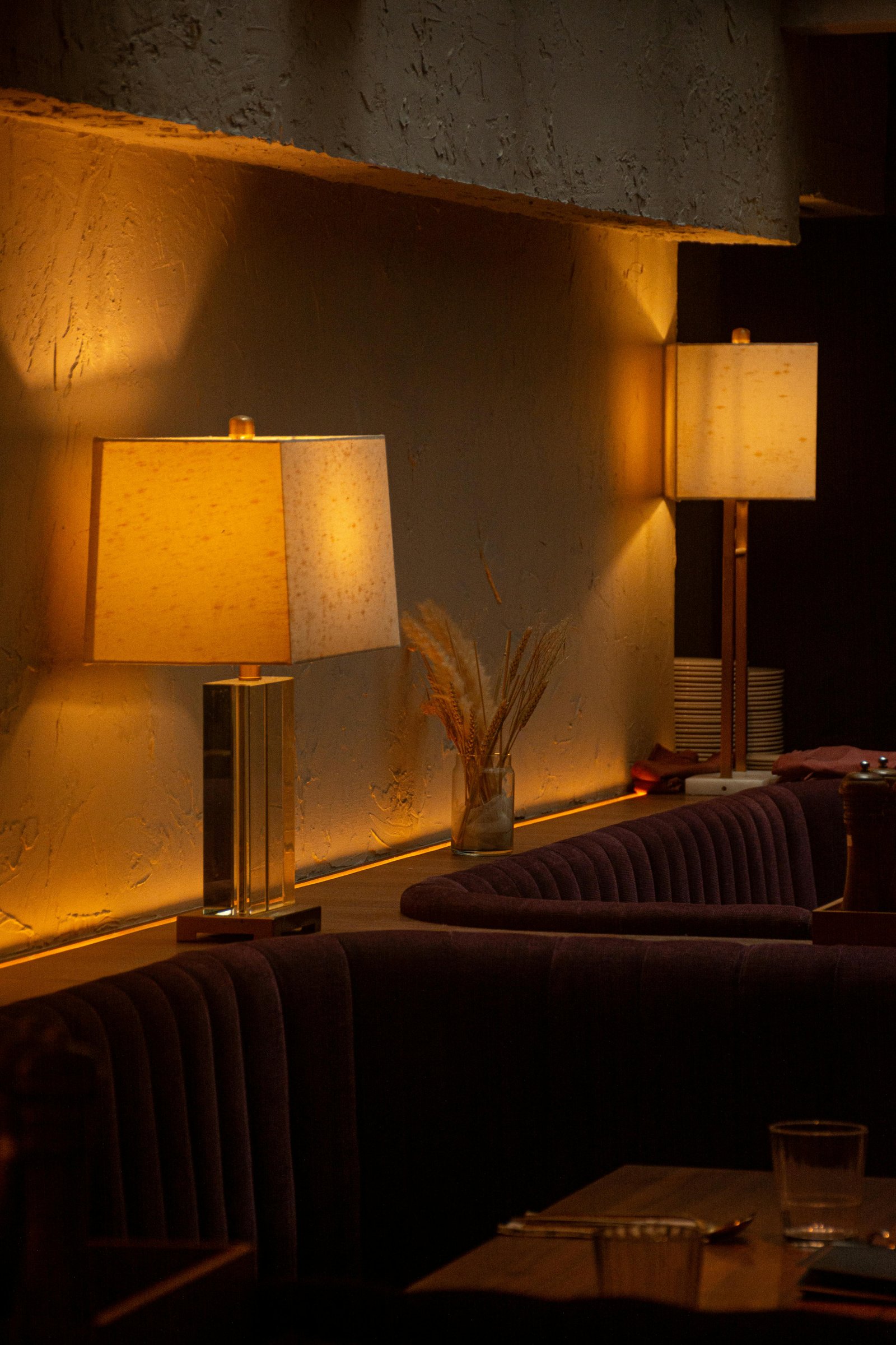 Moody restaurant interior with hand-finished mineral plaster walls — MarkOn® Walls hospitality work